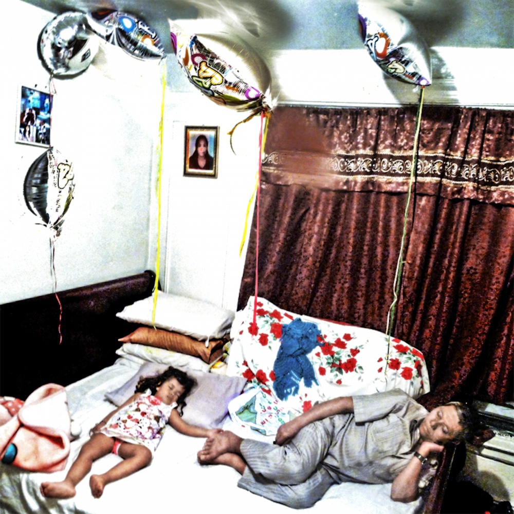 Refugees Resettle - Grandfather and granddaughter after one of many parties.