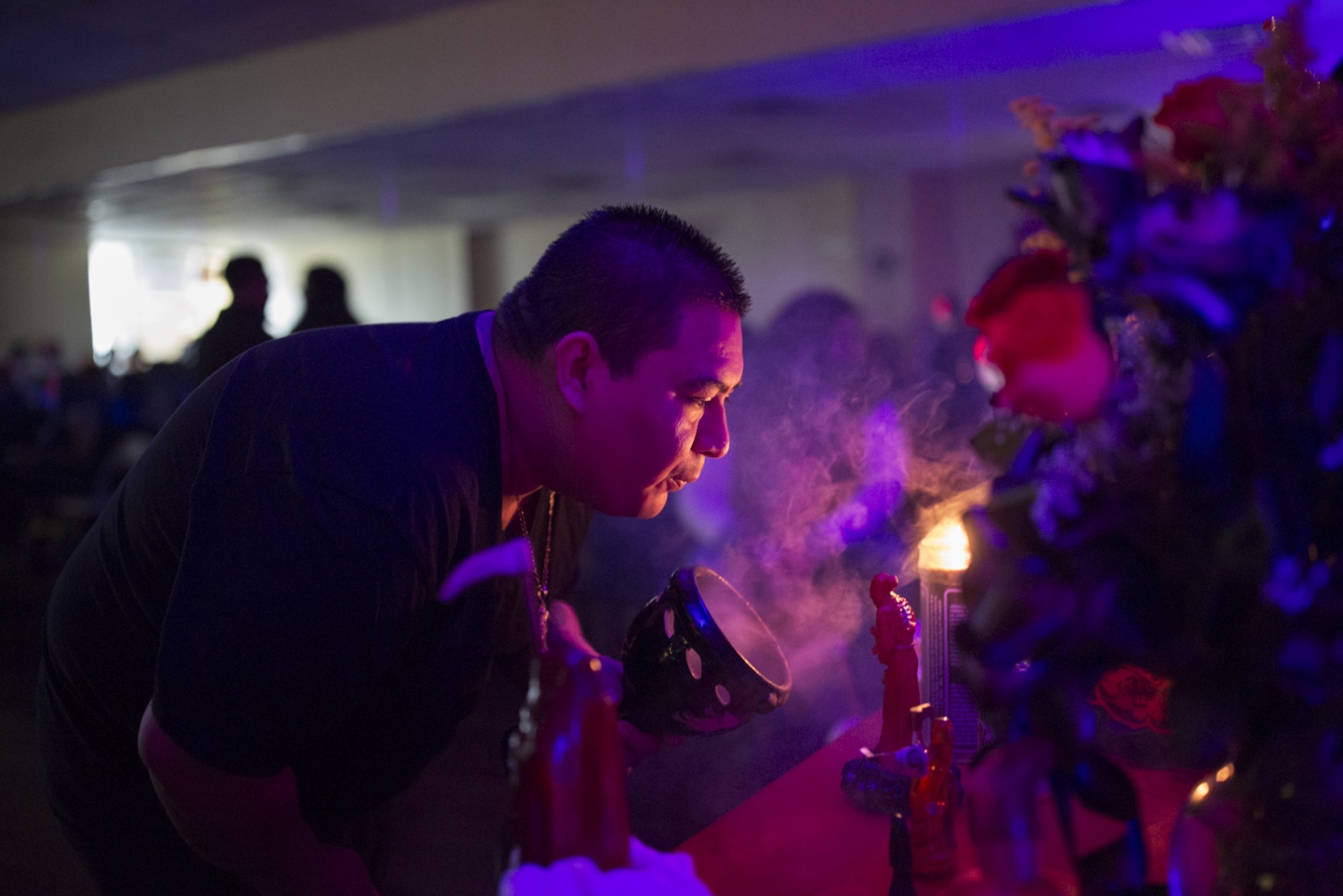 Pasitas Lopez, leader and owner of a botanica dedicated to Santa Muerte, performs a ritual during...