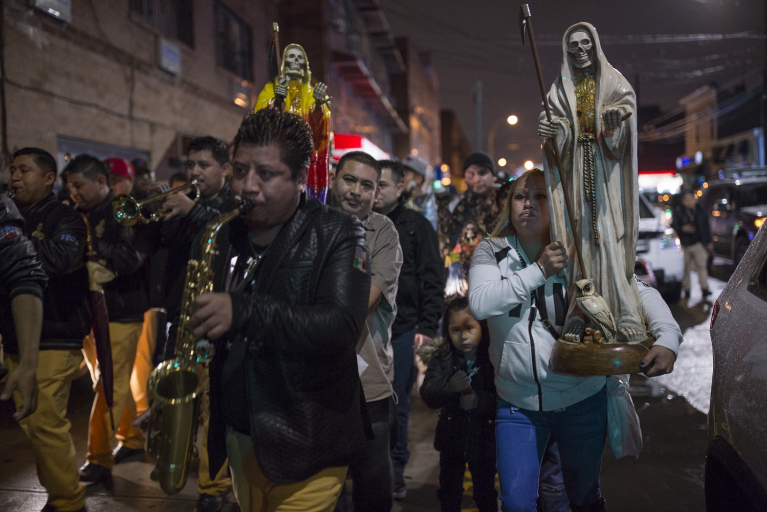 Santa Muerte devotees march in Queens New York, during a Day of the Dead celebration.