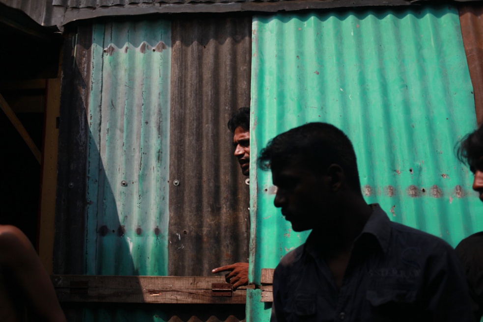 Male clients and shop owners in...l is the largest in Bangladesh.