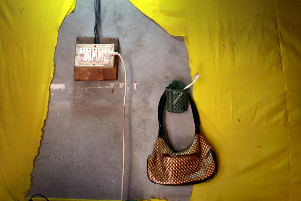 A young prostitutes handbag han...ch she uses to service clients.
