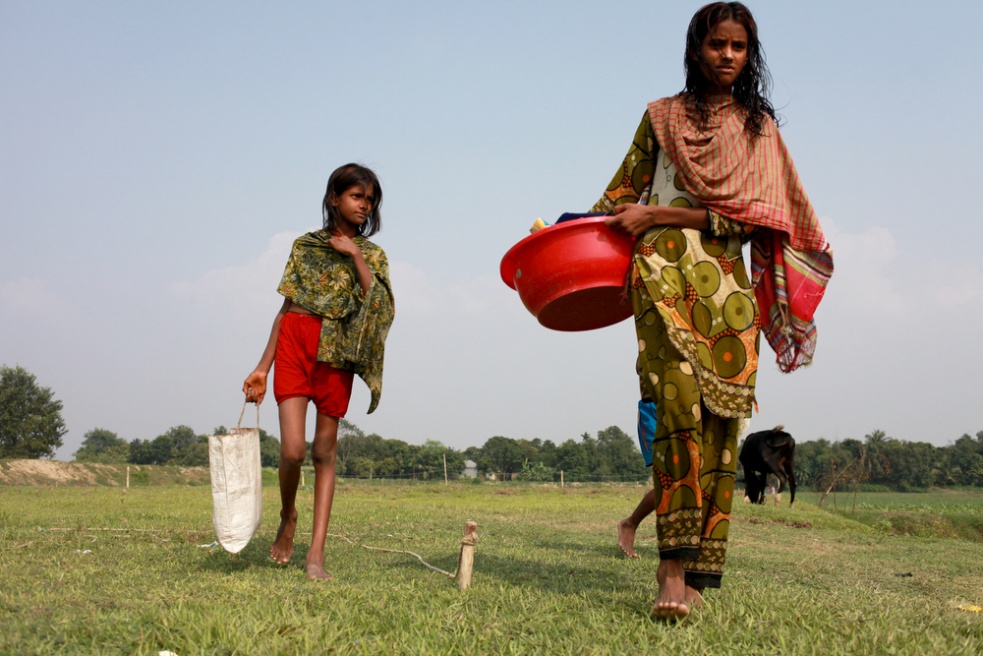 Young girls doing the washing i...itution by the age of 12 or 13.