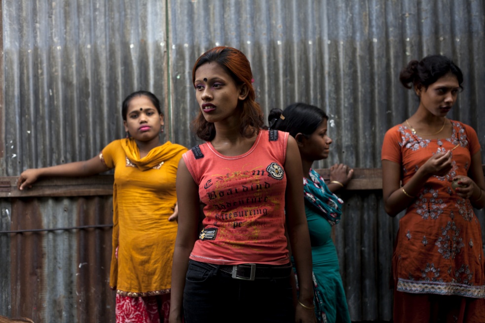 Underage sex workers waiting in...on the banks of the Padma River