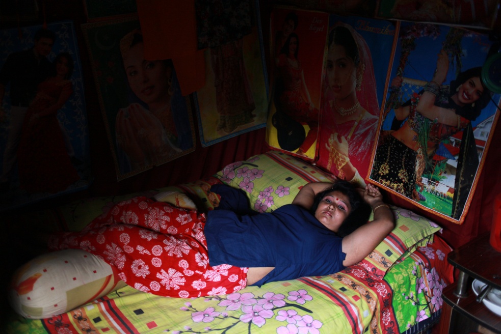 A sex worker relaxing on her be...Daulatdia brothel in bangladesh
