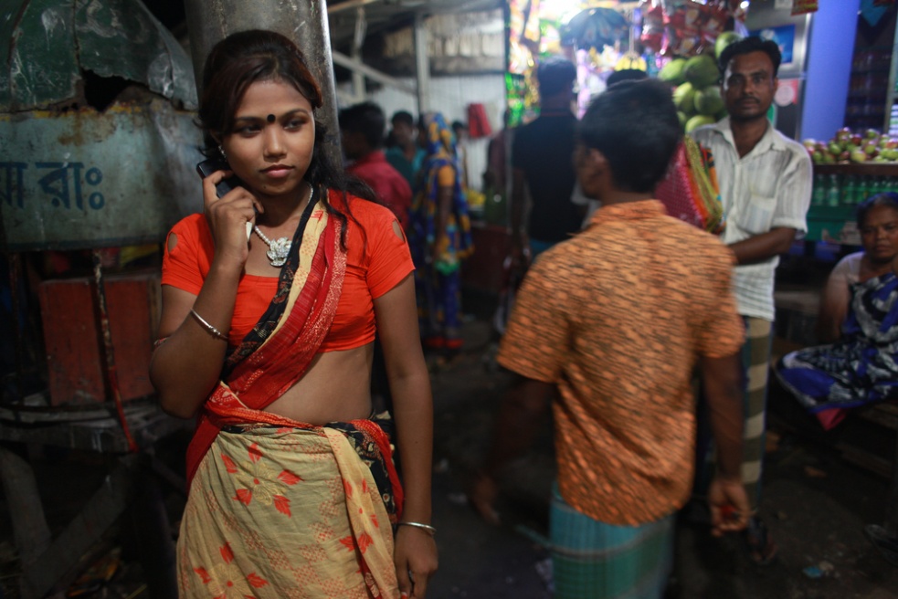 Underage sex worker Bristi wait...on the banks of the Padma River