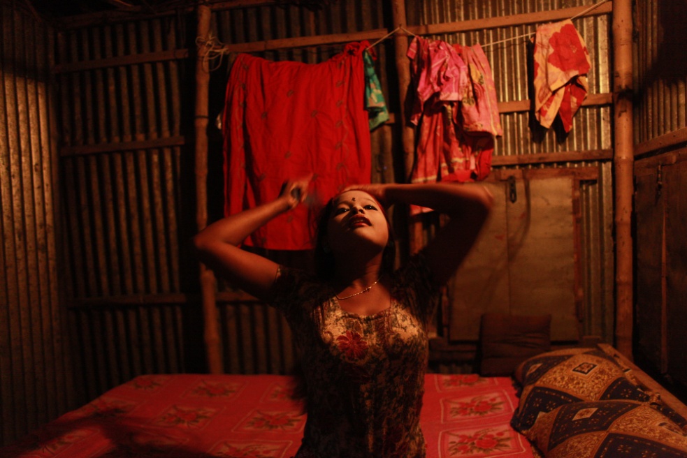 Underage sex worker Sonia prepa...n the banks of the Padma river.