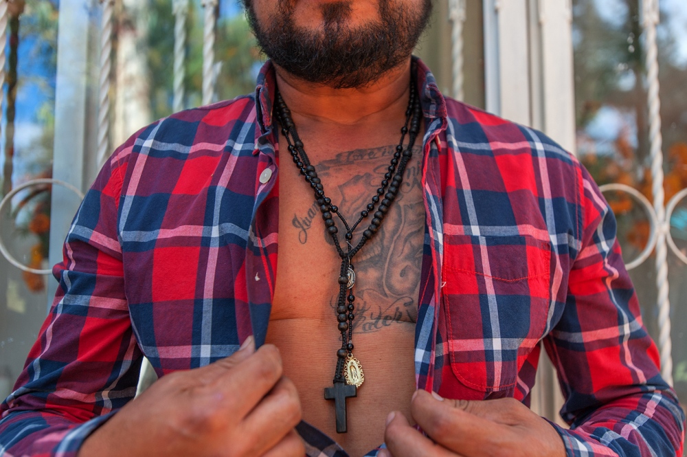  A man shows his tattoos. They ... Machismo is rooted in Mexico. 