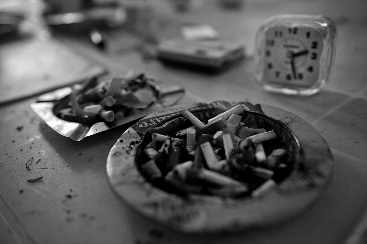 Side effects -  An ashtray full of cigarette butts. Alfio smokes all day...