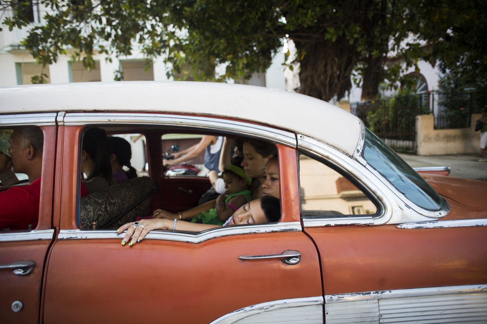 ¡Cuba Libre! - A family rides in a communal taxi in the Miramar...