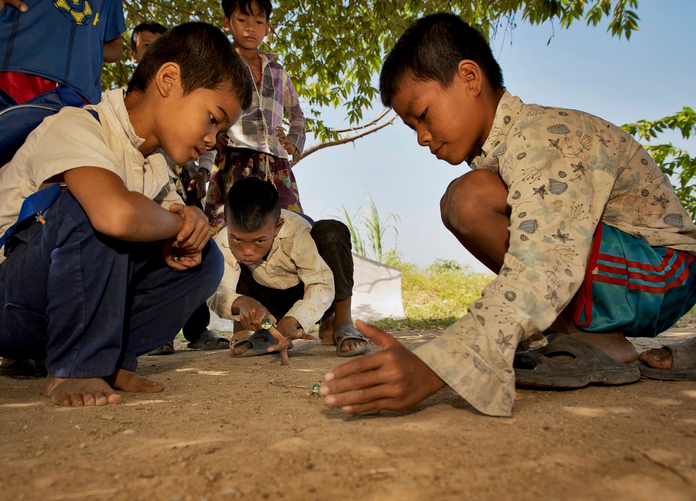 NGO Projects -  Boys playing marbles, Bos Thom, Cambodia 