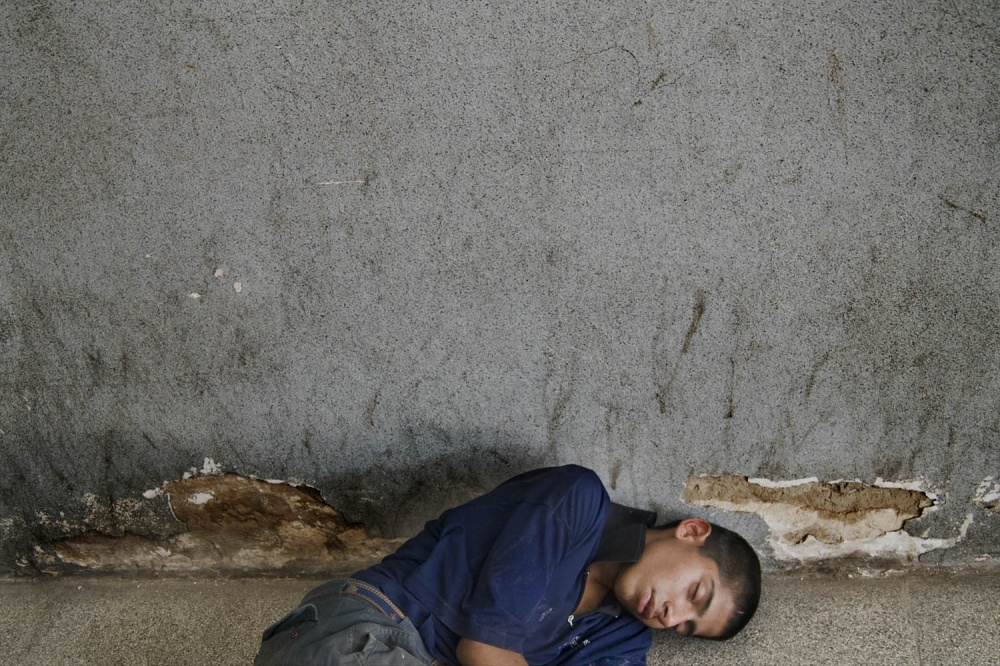 A young drug addict sleeping in... Buenos Aires, Argentina, 2010.