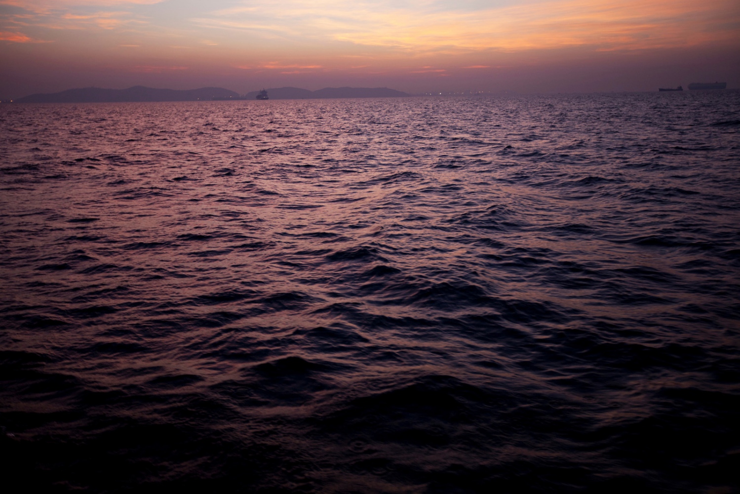 EMPTYING THE SEAS - The Gulf of Thailand at dawn seen from a fishing trawler...