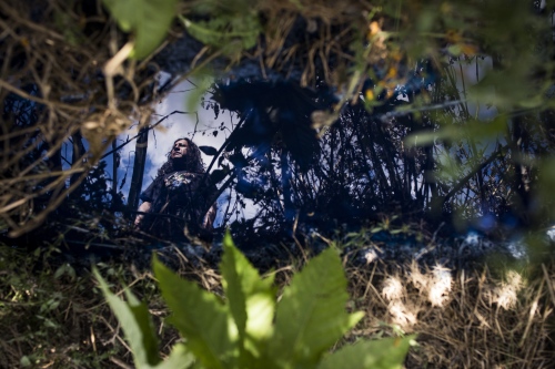 Image from BLUE TOXIC WATER - Martin Barrios, environmental activist, reflected in the...