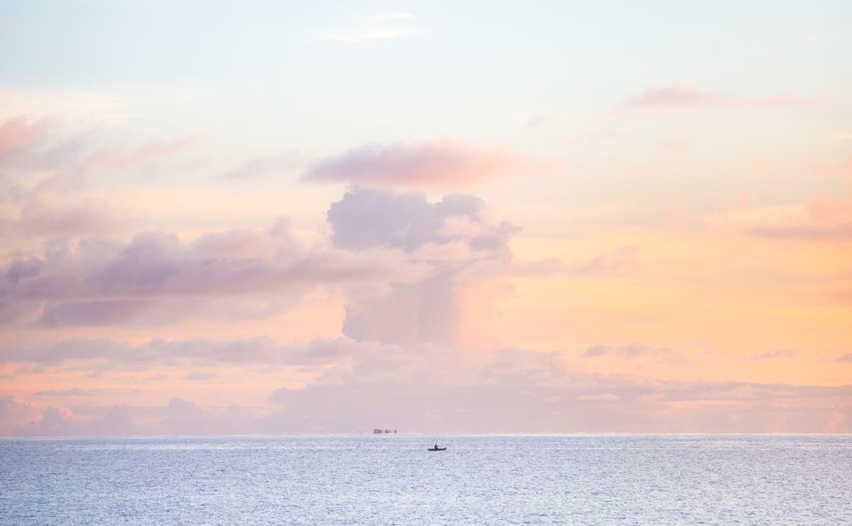 Home - A traditional canoe at sunset in the Funafuti lagoon.