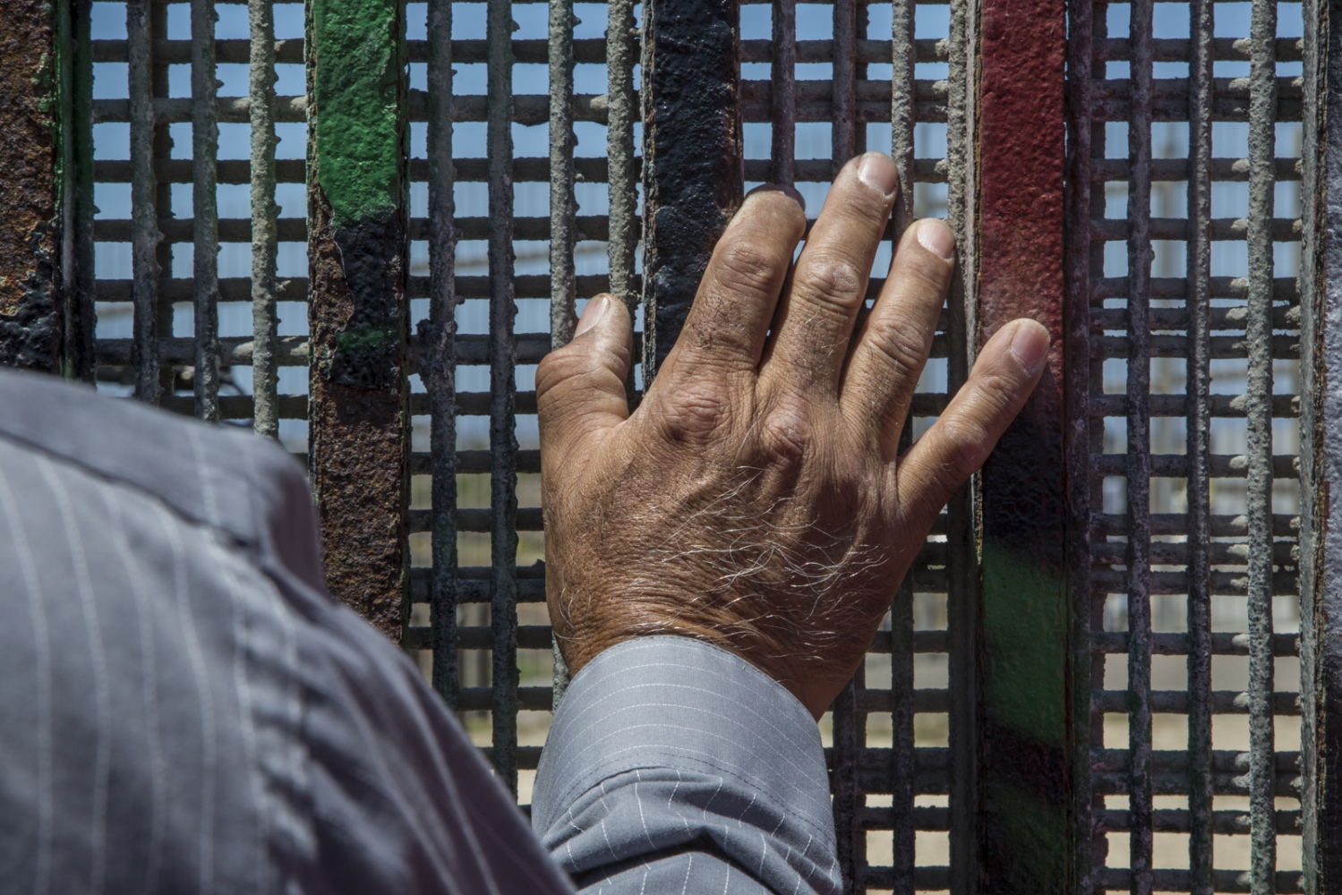 Pastor Guillermo Navarrete of the Methodist Church of Mexico at the border fence during the...