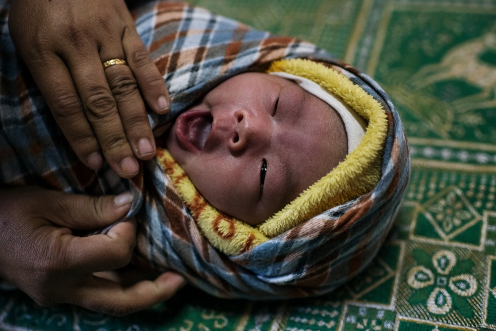 Nhkum Hkawn Lung, 27, two day old baby girl, her third child.