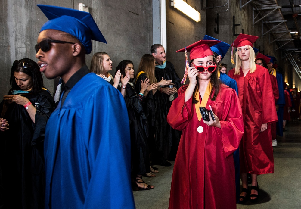 Los Alamitos High School graduates enter the the StubHub Center during the school&#39;s graduation ceremony in Carson, California.