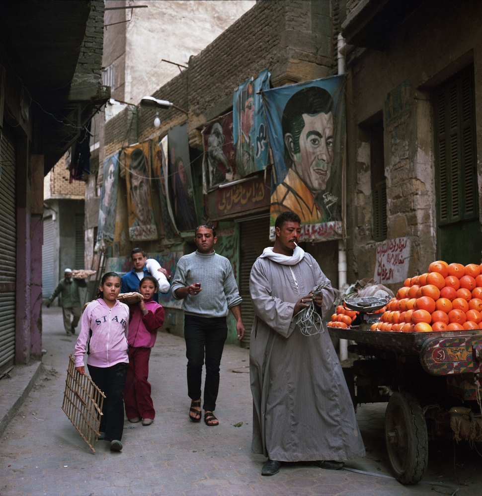 Cairo: Urban Decay -  Street vendor selling oranges in Darb Al Ahmar, an...