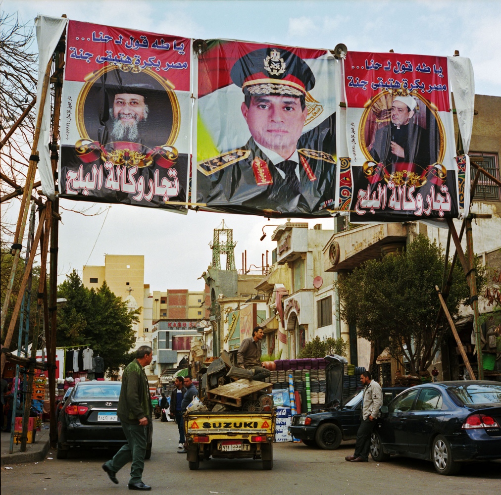  On the eve of elections large scale portraits of Sisi adorned the streets of crowded neighborhoods in Cairo. Mimicking former Egyptian leader...