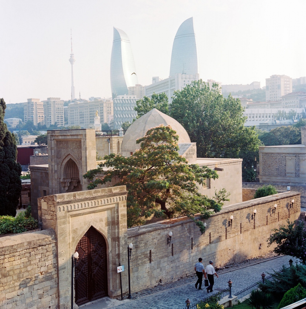 Caspian Mystique -  The sun shines over Baku's Presidential Palace and the...