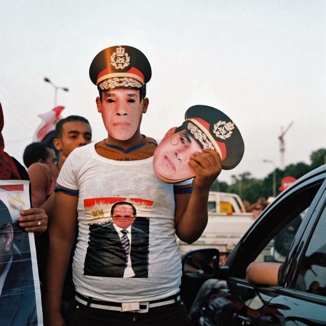  A Cairo vendor sells masks of ...ecause heâ€™s a strong man.â€ 