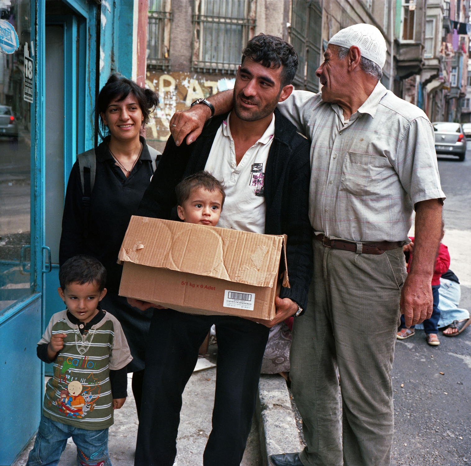 Last Dance of Tarlabasi - Shop owner's family outside their store. Tarlabasi,...