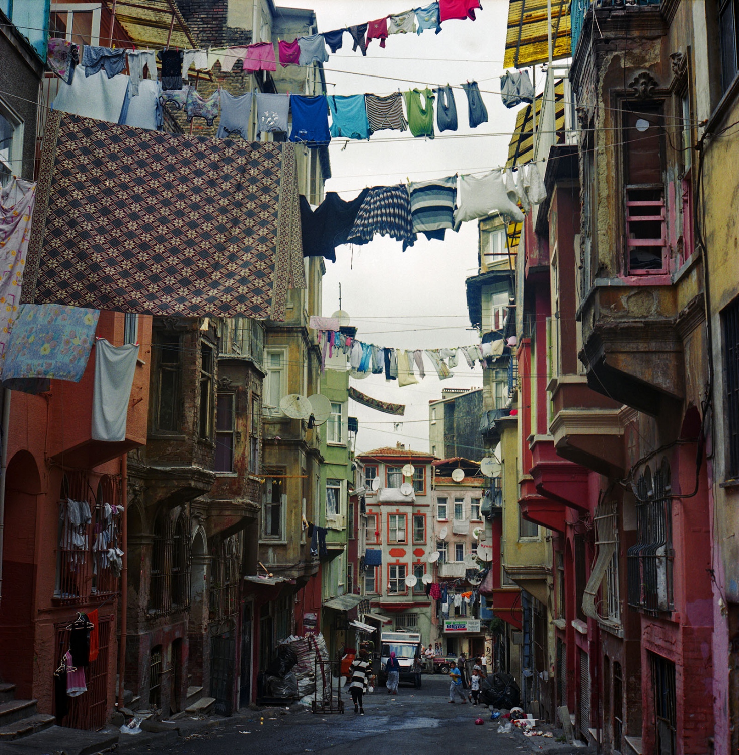 Last Dance of Tarlabasi - Street laundry in Tarlabasi, many buildings are left in...