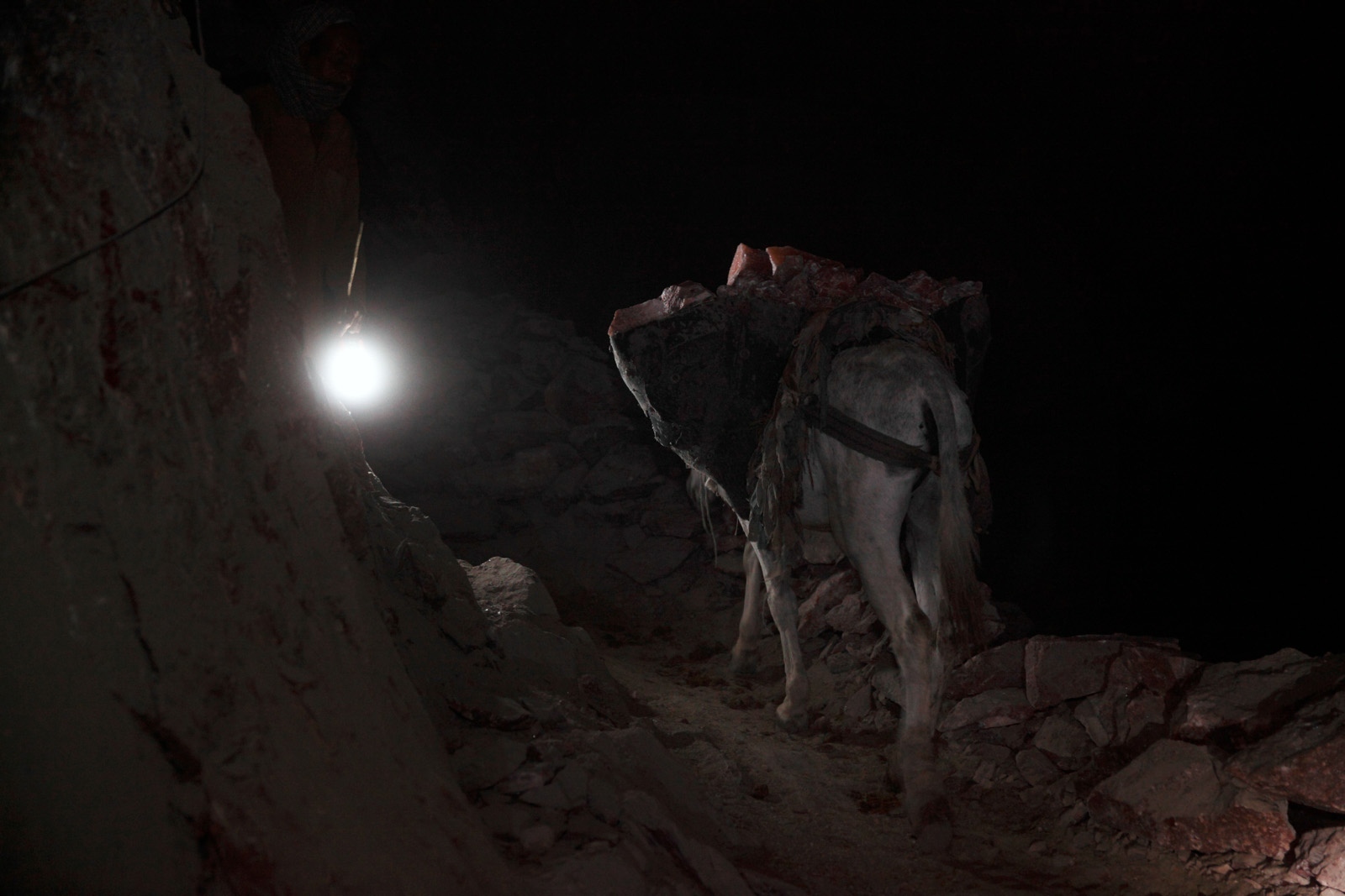 PAKISTAN'S SALT MINES - Throughout the night donkeys are still used at the remote...