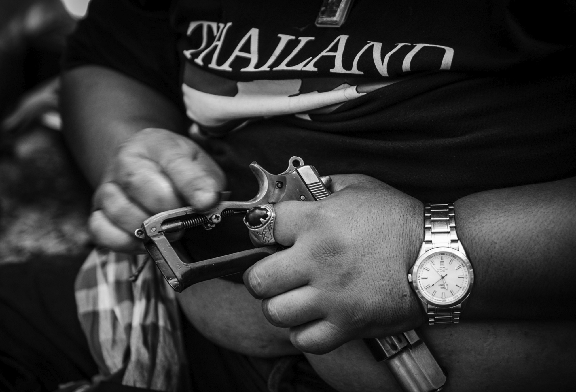 Shutdown Bangkok -  A PDRC member cleans his weapon in one of their camps in...