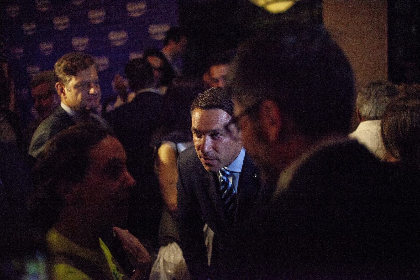  Tales from Trumpland, Republican Michael Grimm, after he conceded to Dan Donovan at the Hilton Garden Inn on Staten Island during the Republican congressional primary, came down to greet his supporters. Donovan had 64.2% of the votes vs. Grimm's 35.8%. Michael Gerard Grimm (born February 7, 1970) is an American businessman, convicted felon, retired Marine and politician who represented New York in the United States Congress from 2011 to 2015. Grimm represented New York's 13th congressional district during his first term, after which he represented New York's 11th congressional district. Both districts consisted of Staten Island and parts of Brooklyn. Grimm is a member of the Republican Party, and during his time in office was the only Republican to represent a significant portion of New York City. On July 17, 2015, Grimm was sentenced to eight months in prison for tax evasion. Staten Island, NY June 26, 2018 (Kevin C. Downs/Agence Cosmos) 