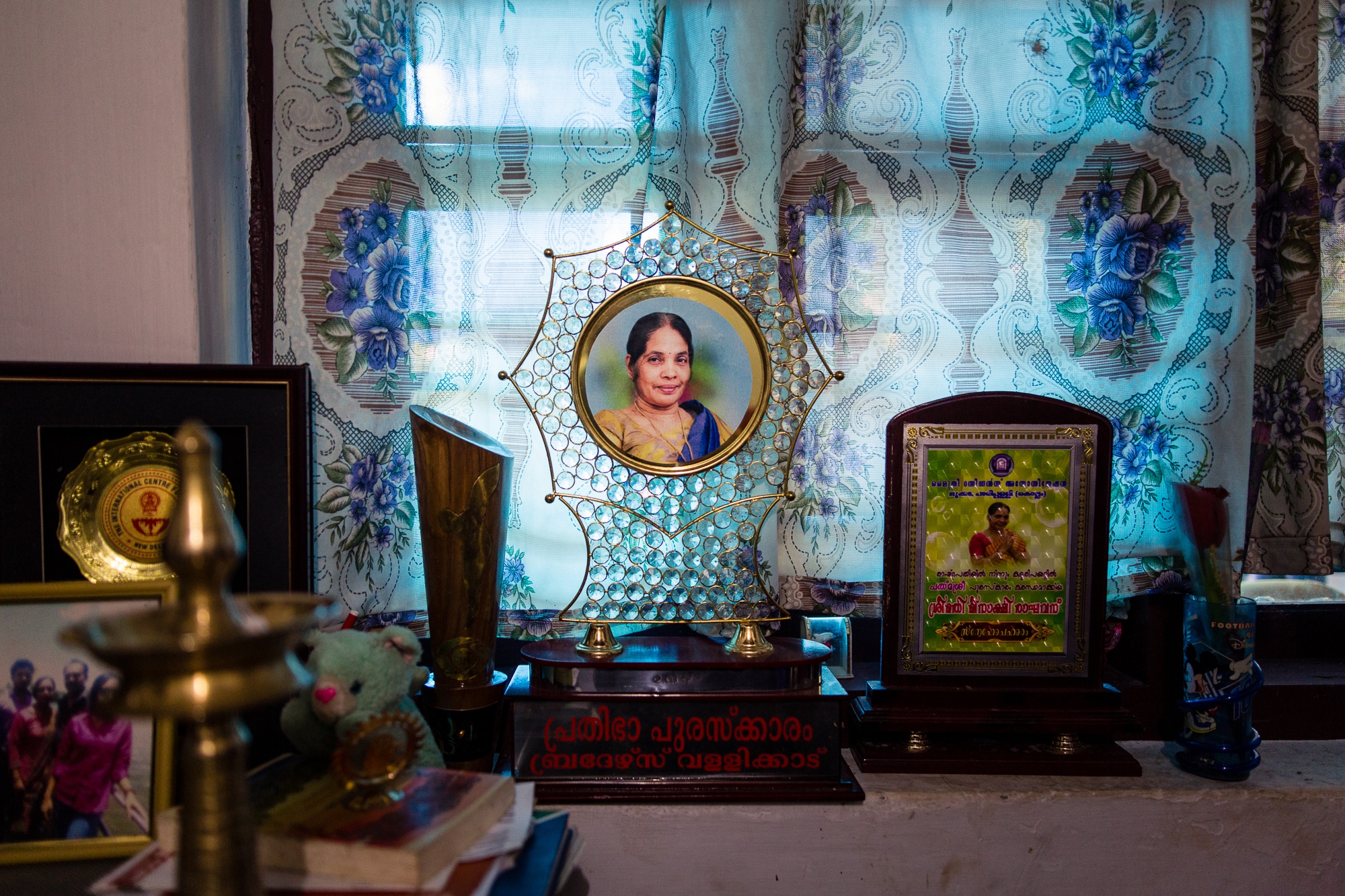  Vatakara, Kerala, INDIA - September 12, 2017: One of many trophies that were given to Meenakshi rests on a window still in her house. 