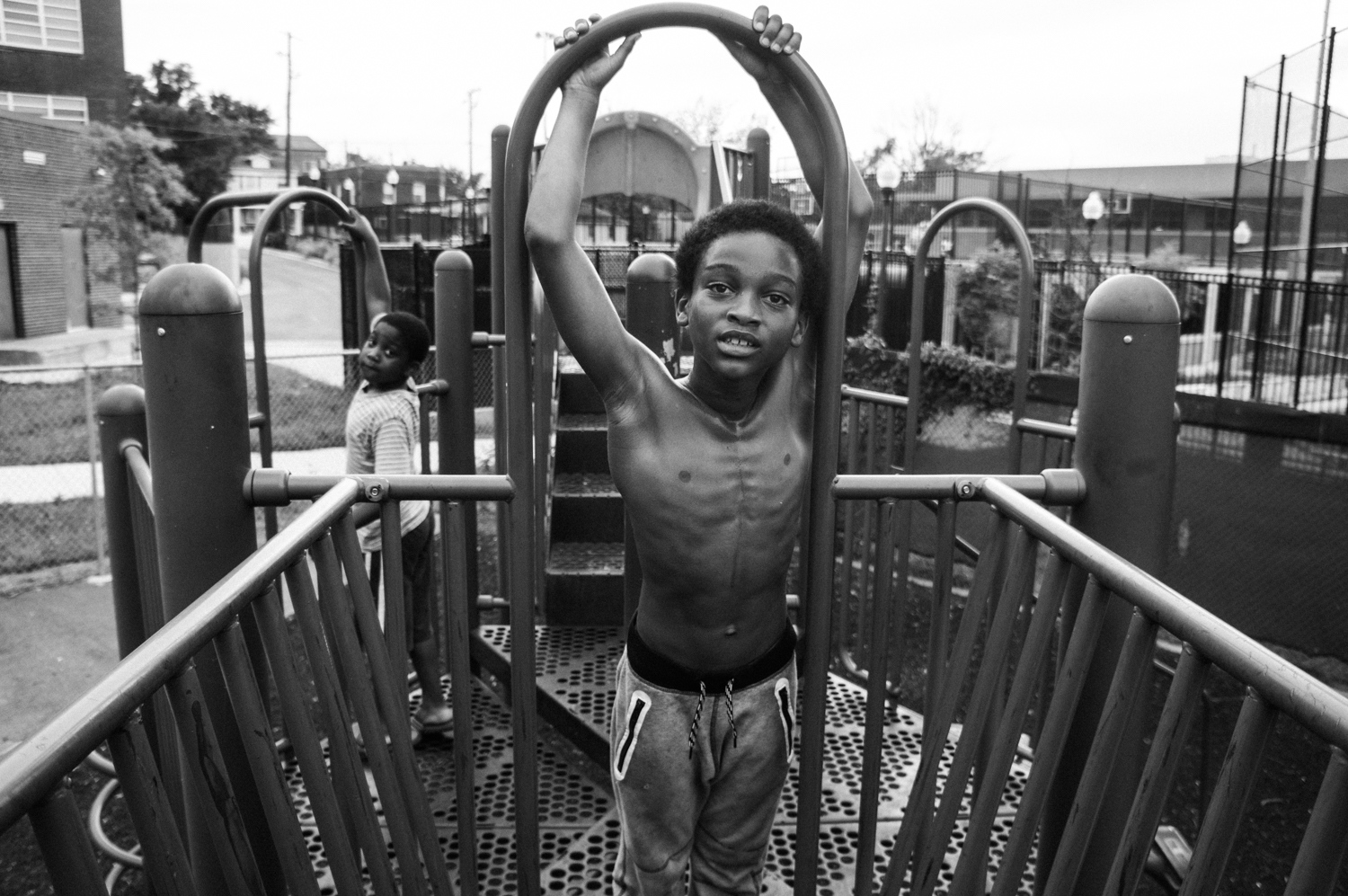  Dylan Marshall swings on a playground with his friend &ldquo;Little Sean&rdquo; on July...