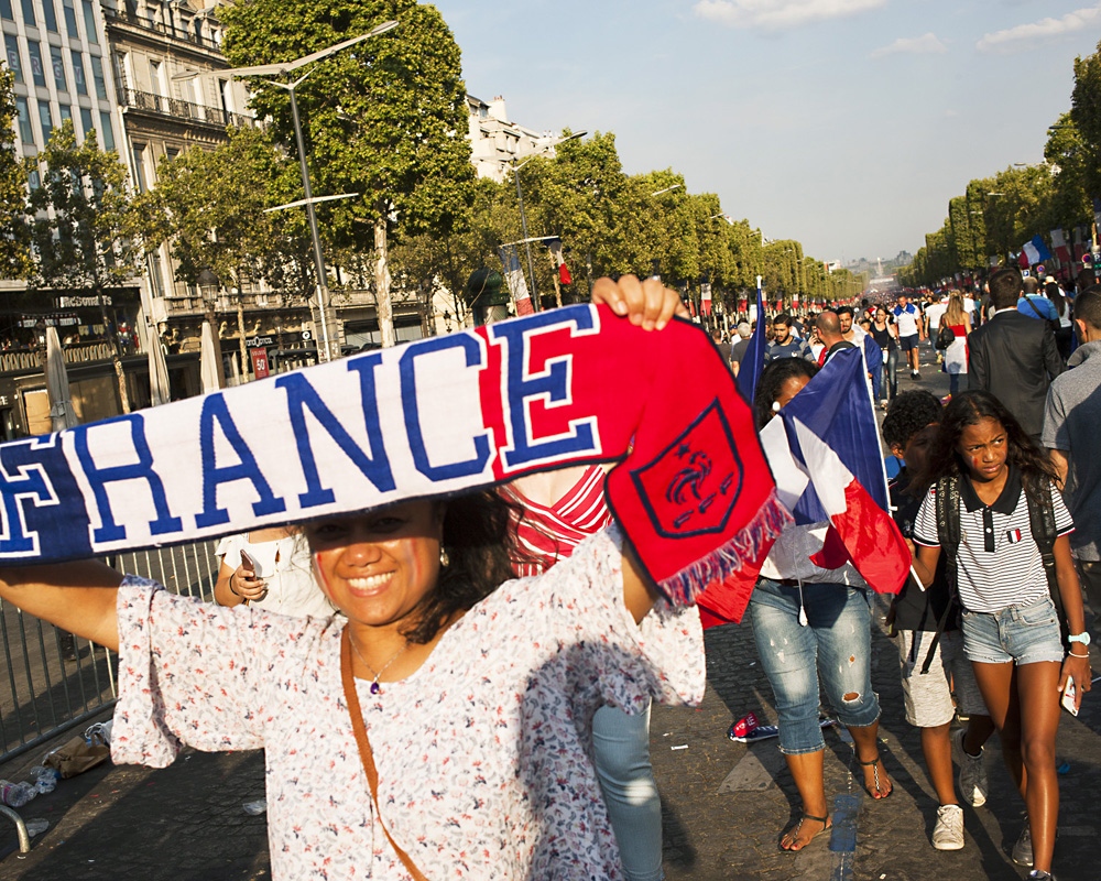  Fans celebrate the French team at the Champs &Eacute;lys&eacute;e avenue in Paris. Les...