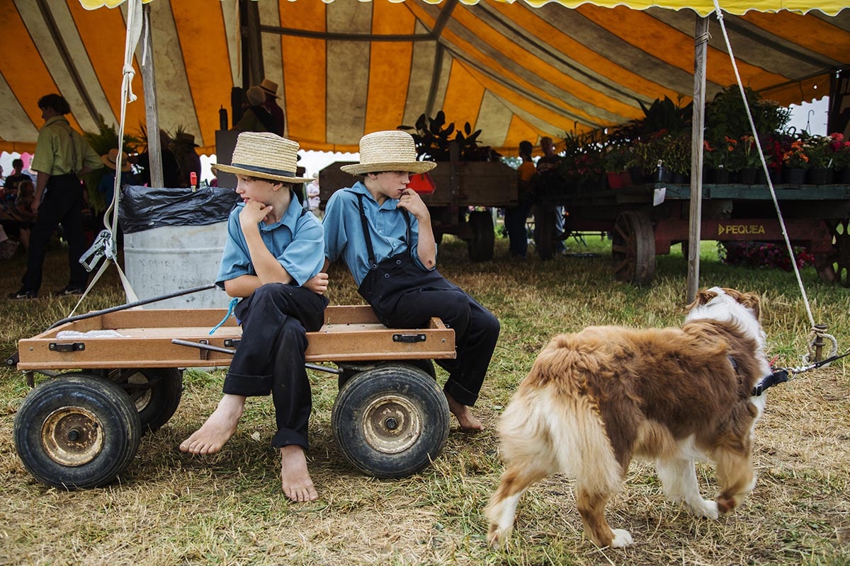 The Amish world -  In their modest attire, these boys wait for the end of...