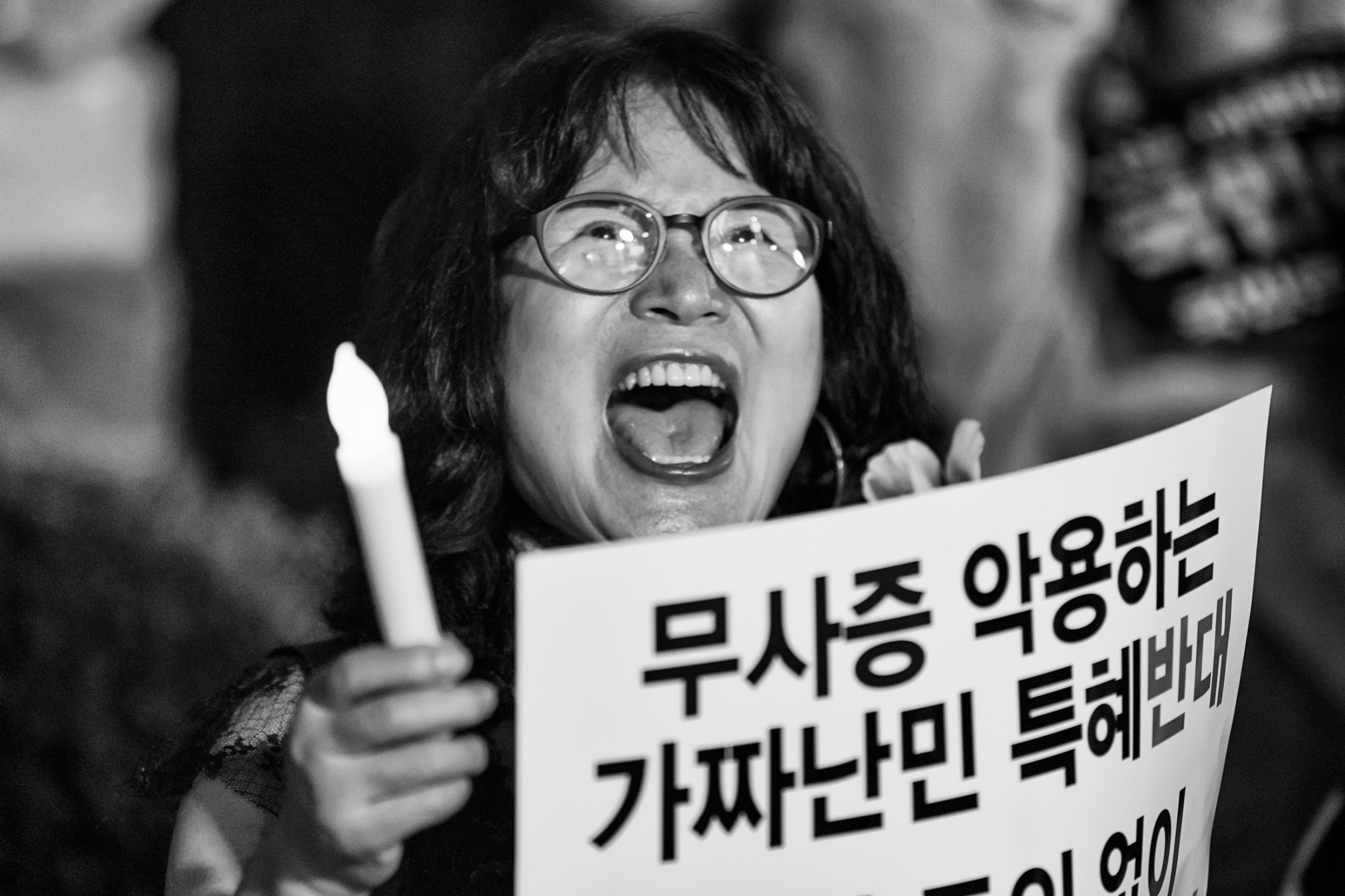 The Visitors from 8,000km Away -   The protesters chant many messages like "Koreans...