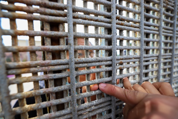 79 year old Martha Ochoa says she longs for a kiss and hug from her son and granddaughter but she&rsquo;ll settle for this: the tips of their fingers touching through a double meshed fence.     