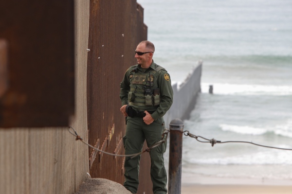 Image from Friendship Park  - Border Patrol Agent Bush smiling and chatting with people...