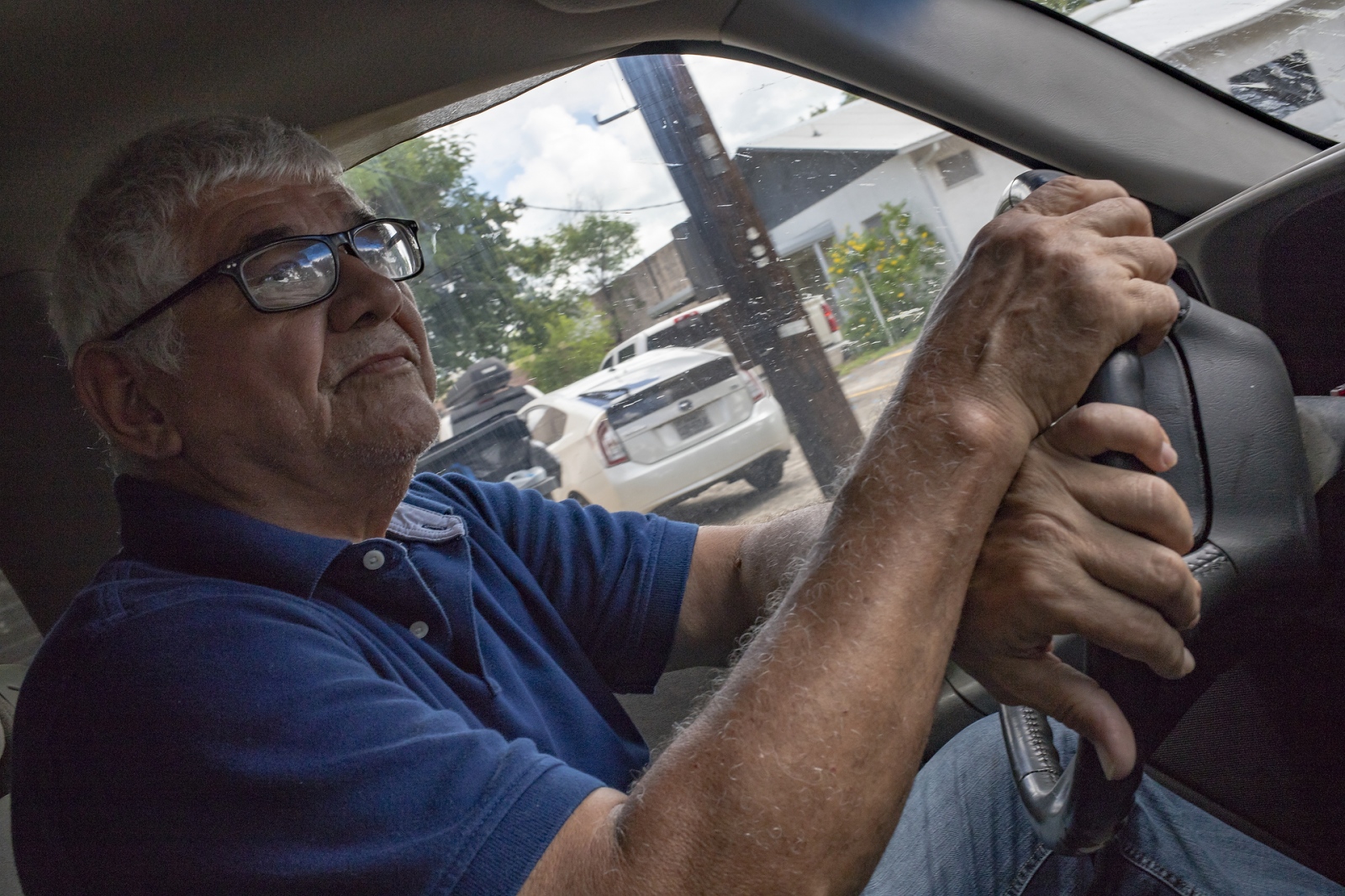 Image from Looking for America - Eddie Canales is in his truck driving volunteers and...