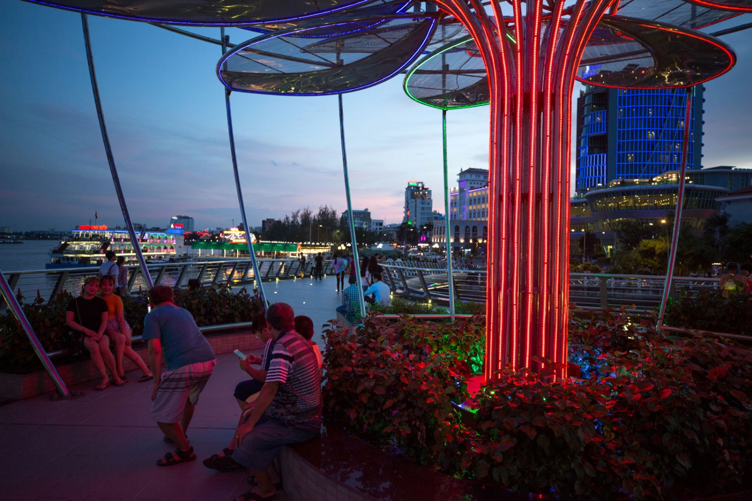  A newly developed river side area provides locals and tourists with brightly coloured neon...