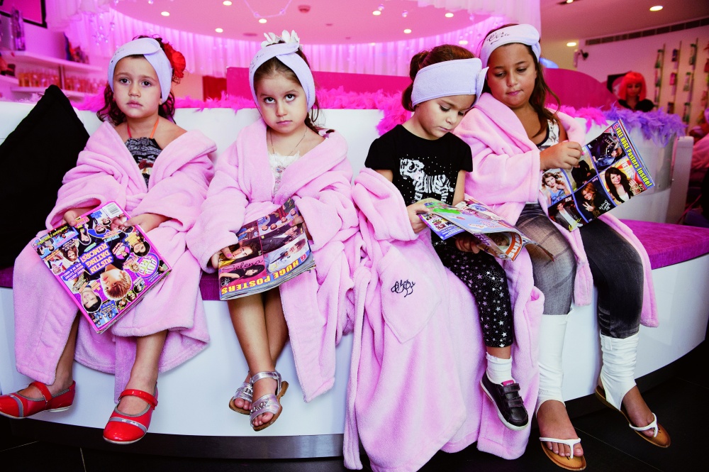Young girls wait for their make-overs at a nine-year-old's beauty birthday party held at Frizzy's Chez Lulu Beauty Salon in Beirut, Lebanon.