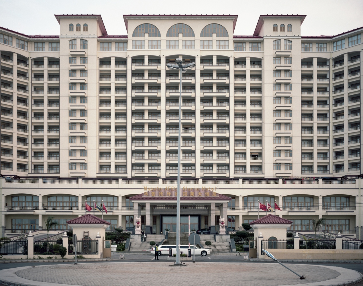  The Gloria Hotel owned by a Chinese group. The Gloria Hotel has been built on the new seaside road and it includes a Casino and a Chinese super-market. The cost of the hotel was of US$ 250 million. 