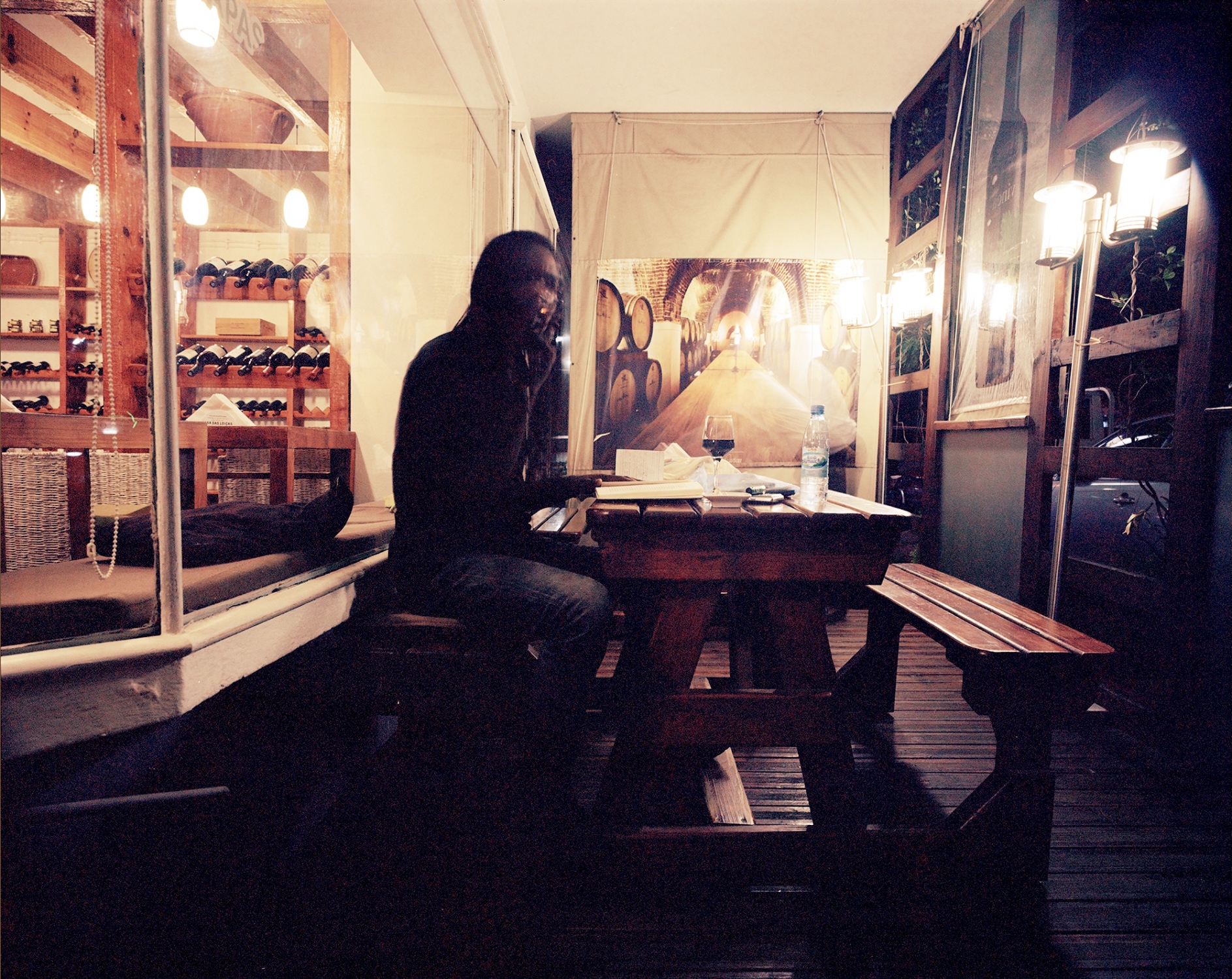 Spaces - Felix Mula working in a cofee table, Maputo, Mozambique....
