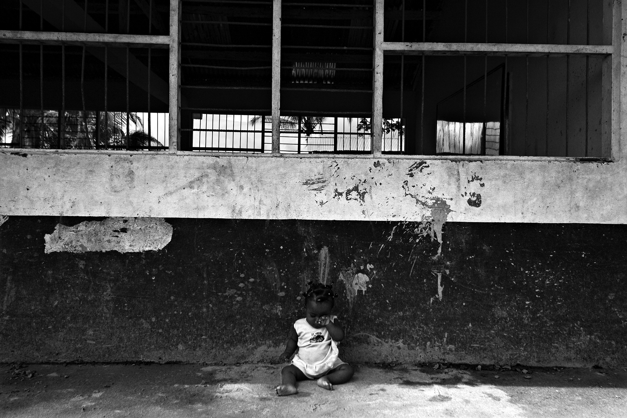 Forced Displacement in Chocó - A child cries while being left in the shade by his...