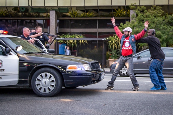 Image from Veteran Pursuit -  LAPD officers are shouting commands at both men. They...