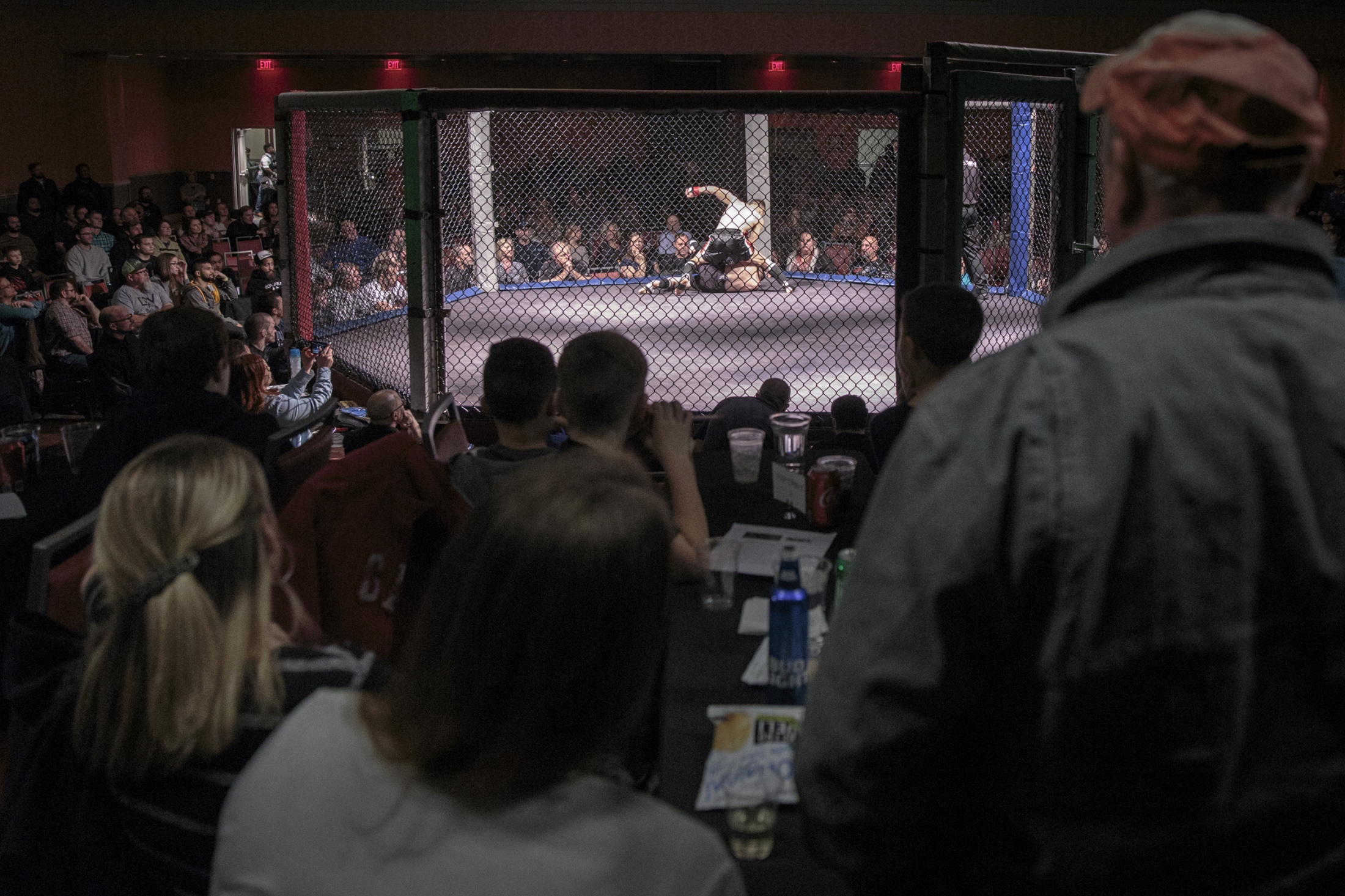 Young Cage Fighters - Crowds gather around the cage as Brandon Apodaca, 15,...