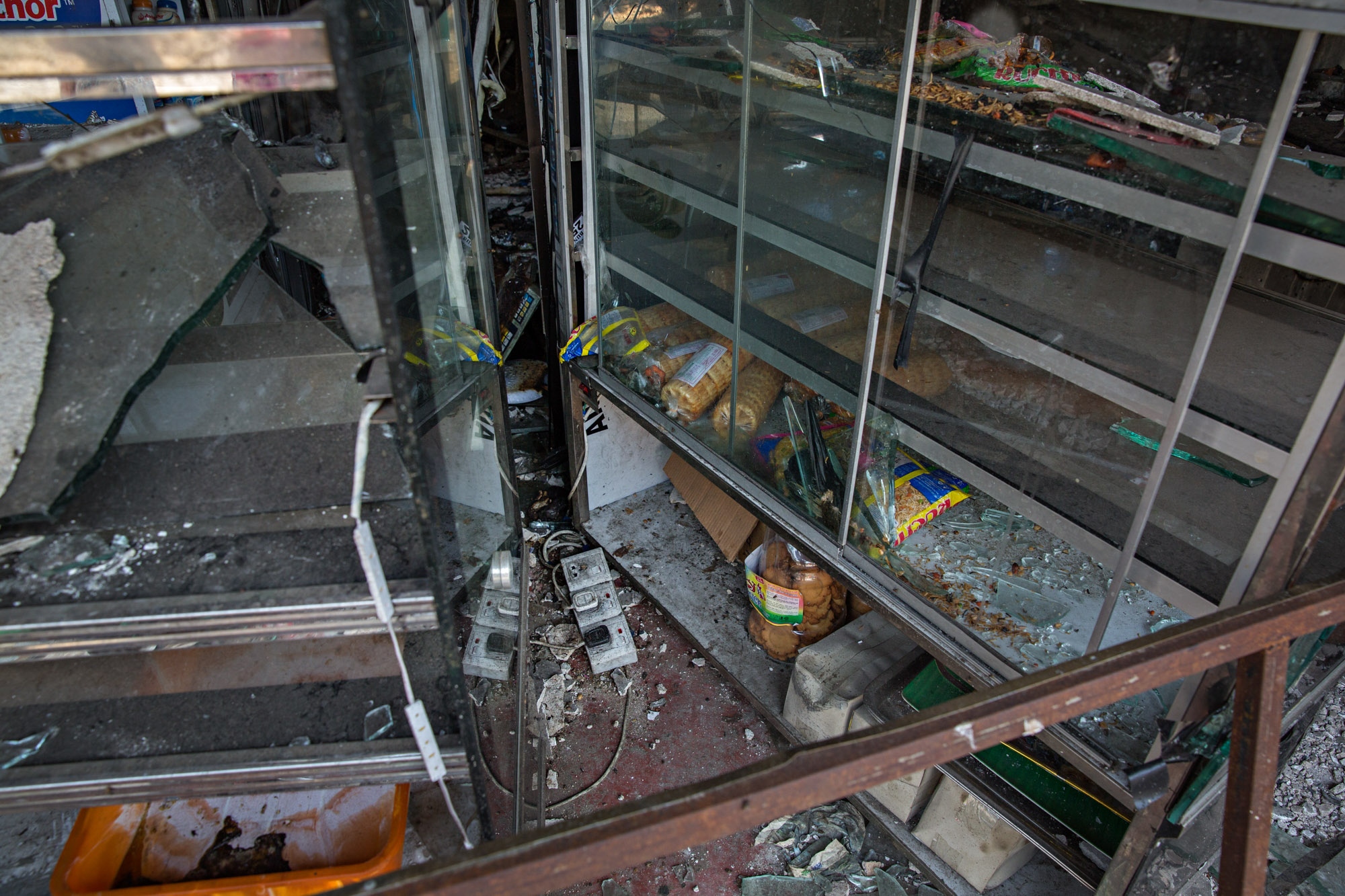 Sri Lanka Religious Violence: Buzzfeed News -  A wrecked store front at Eighth Mile Post, Akurana, Sri...