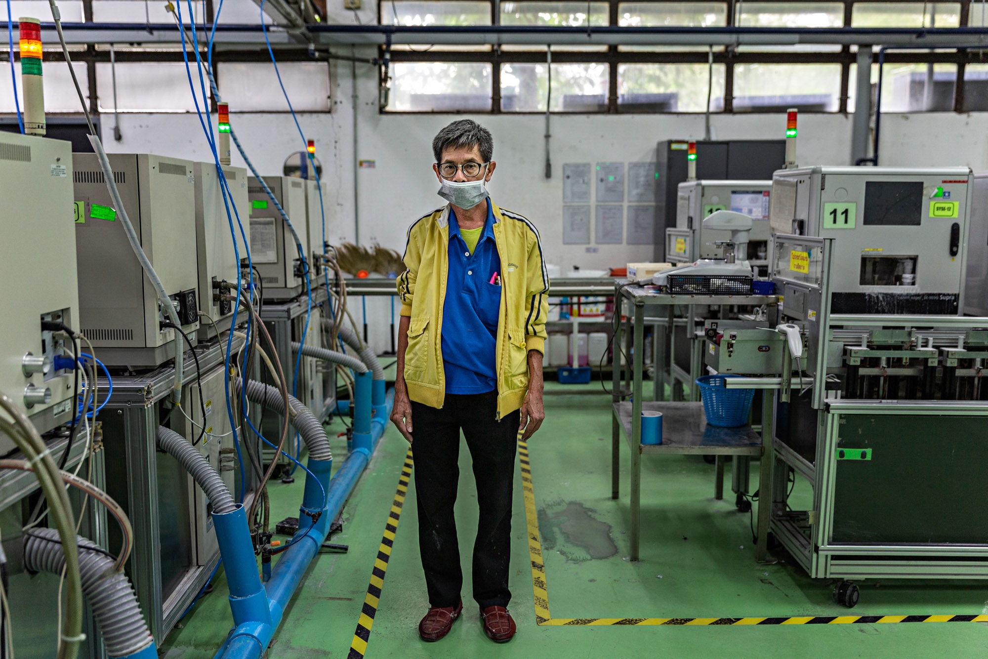 Thailand Glasses Factory: Stern - Mr. Theerayuth Meeneadtree, 53, poses for a portrait at...