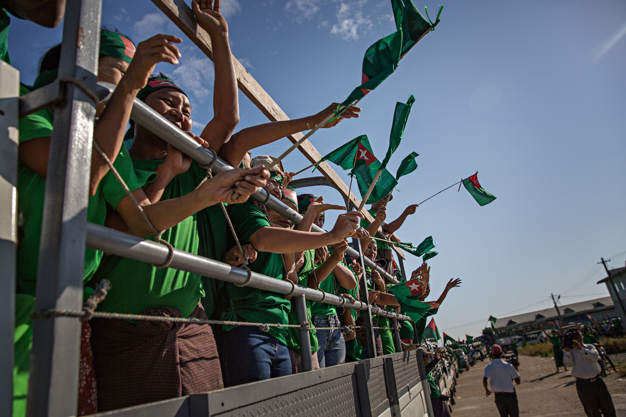 USDP (Union Solidarity and Development Party) supporters wave flags during a rally near Hinthada, Myanmar, November 2015.
