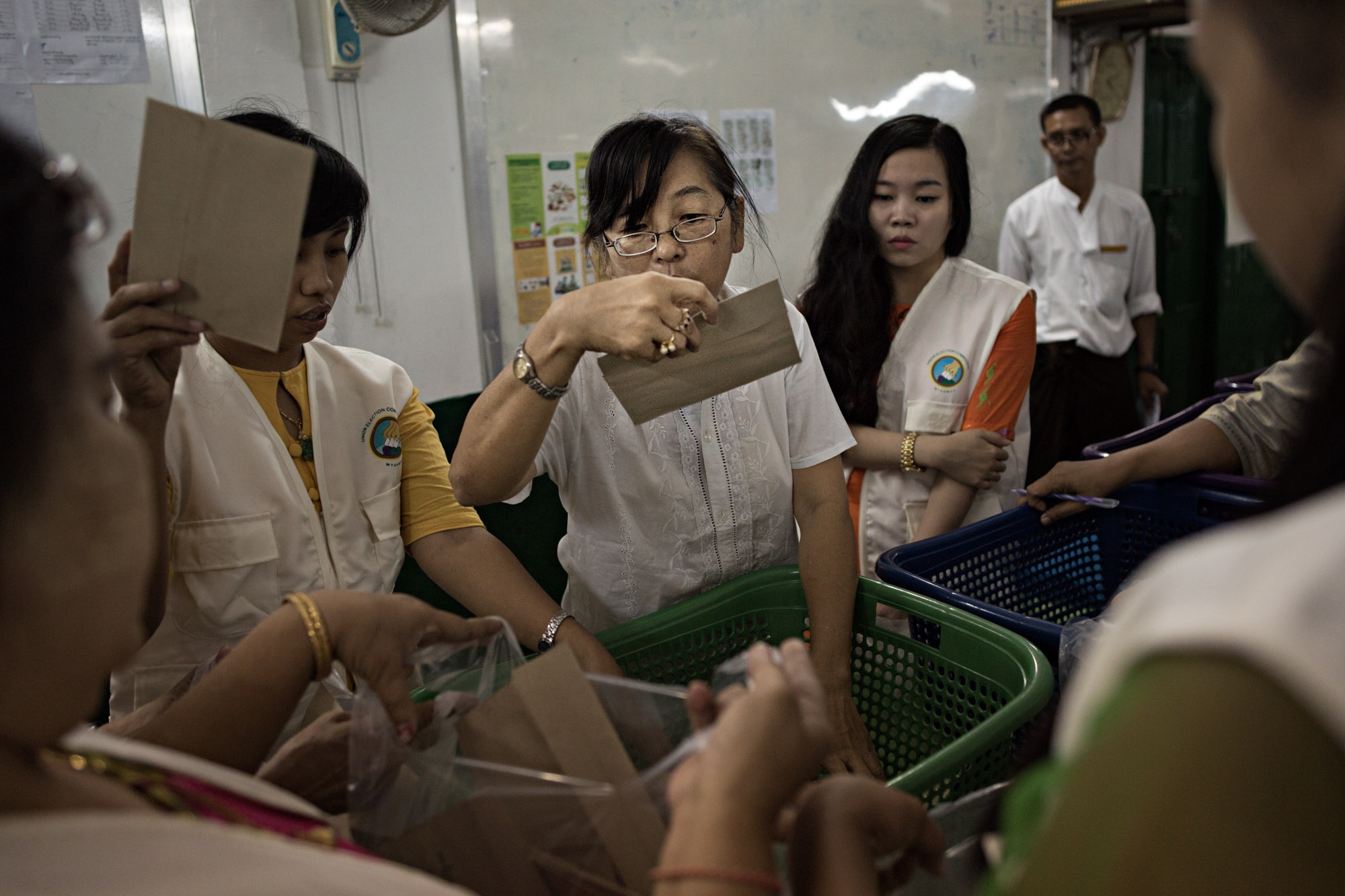 Myanmar Election: Al Jazeera - Election workers count votes in Yangon, Myanmar, 2015.