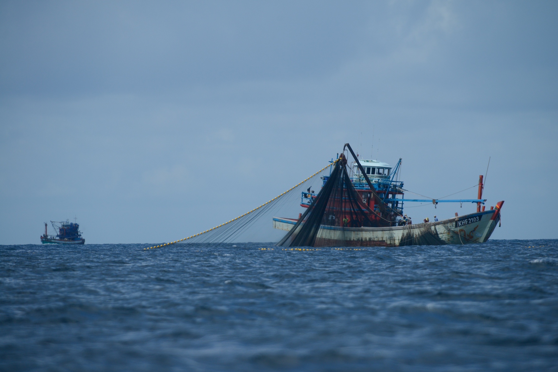 Lipe Island - Large fishing boats are trawling the sea near the island...